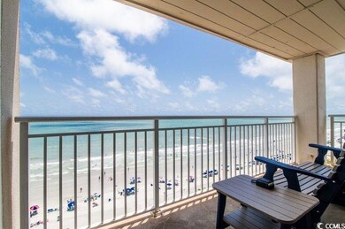 Balcony with a beach view and a water view