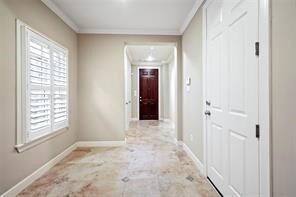 The view highlights the spacious foyer looking bac
