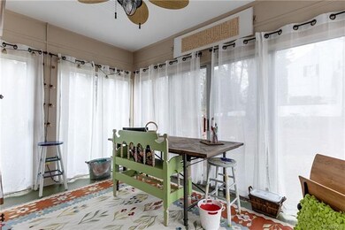 Sun porch (not heated/cooled) is currently used as