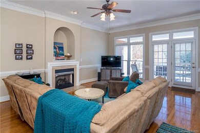 Great Room has wall of windows + French door to co