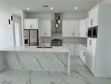 Kitchen featuring appliances with stainless steel