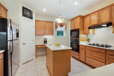 Kitchen features walk-in pantry and built-in desk 