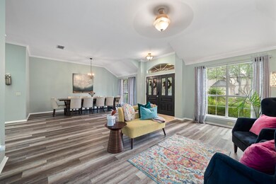 Living room with wood finished floors, lofted cei