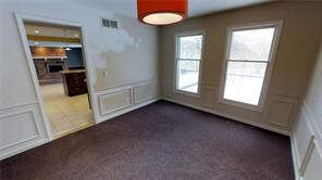 Dining Room:  More wainscoting detail in formal Dining Room.  Does need some finishing touches on the walls. 