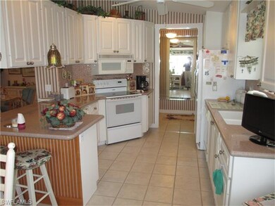 Kitchen with quartz counter tops and tile back spl