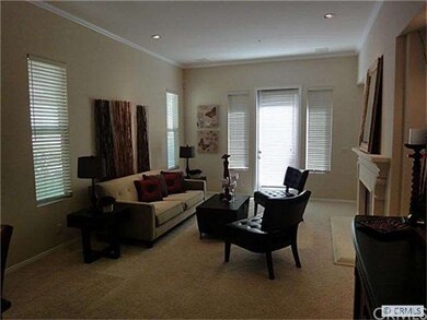 Family Room with Fireplace and Door to Patio