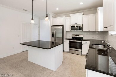 Kitchen with appliances with stainless steel finis