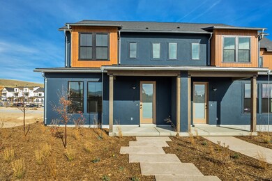 Rear view of house featuring covered porch