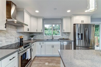 Brand new Appliances, Cabinets with soft touch drawers and doors! New countertops, Window that over looks expansive deck and backyard.