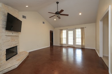 This spacious living room features a high ceiling