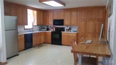 Spacious Kitchen - MW, DW and Range are less than 5 yrs old and do stay with the home - Computer area table is not built in.