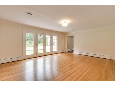 Spacious Formal living room with Hardwood floors, Door to patio