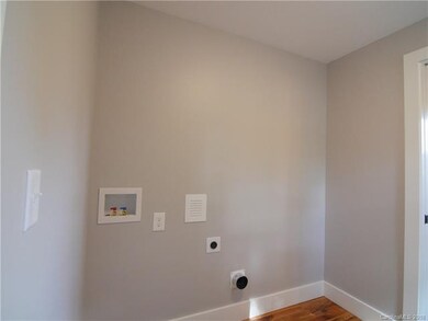 Utility room behind kitchen.