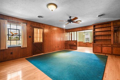 Family Room has built in bookshelves and opens to kitchen/breakfast area