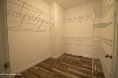 Primary Bedroom walk-in closet