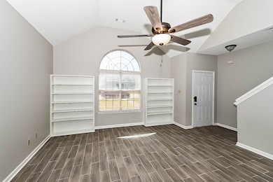 Unfurnished living room with wood finished floors,