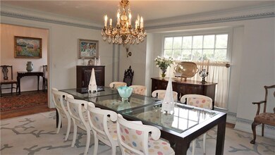 Large Formal Dining Room with wood floors opens of