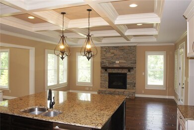 Gorgeous kitchen/hearth room with coffered ceiling. 