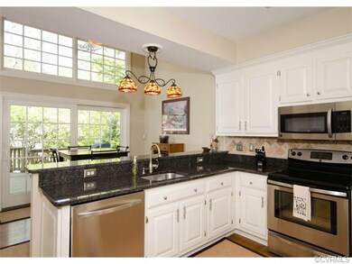 The kitchen has been remodeled with granite counte