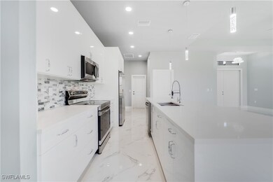 Kitchen with appliances with stainless steel finis