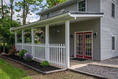 Adorable front porch! This home looks like a doll
