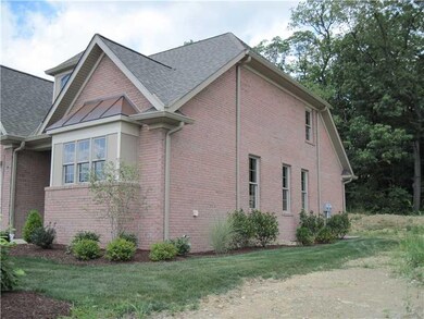Exterior Front. House backs up to woods