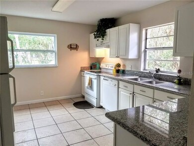 KITCHEN W/ GRANITE COUNTERS AND TONS OF CABINETS