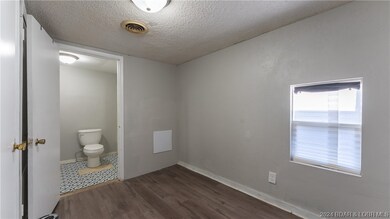 Bedroom leads to the bathroom.