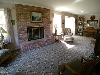 Living room w/fireplace &sunny windows
