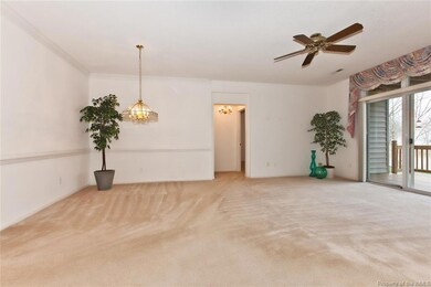 Living room and dining area.  Hall to master bedroom suite.
