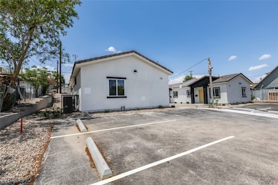 View of front of property with uncovered parking,