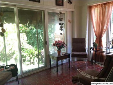 Nice sunroom to enjoy that morning coffee...