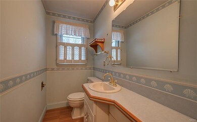 Spacious half bath off the front hall -