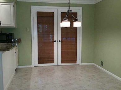 Kitchen. Breakfast Area with French doors onto lar