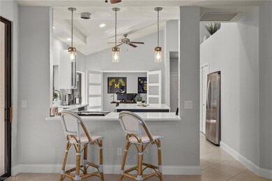 Kitchen featuring hanging light fixtures, vaulted 