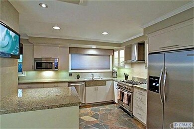 Recently remodeled kitchen with sea foam granite a