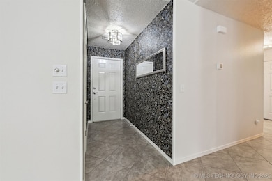New accent wallpaper for inviting foyer.