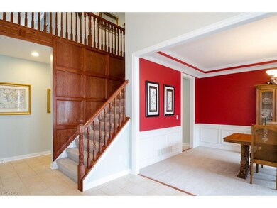 Tiled Center Hallway, Wide Staircase, Stained Pane