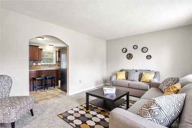 Currently a living room area but could be a formal dining room/flex space