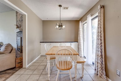 Dining room has large sliding patio door and great