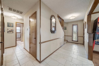 Foyer view and to the downstairs master bedroom an
