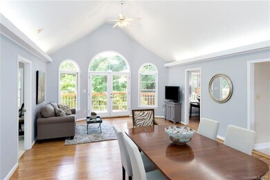 Great room and dining area with vaulted  ceilings 