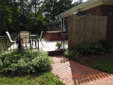 DECK WITH WROUGHT IRON RAILS AND HOT TUB