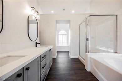 Bathroom with double vanity, a garden tub, a showe