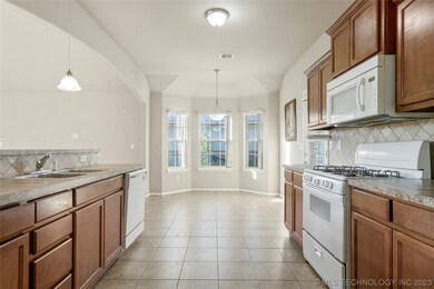 Kitchen opens to living room and dining room