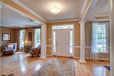 What an entry! The wide foyer with wide-plank hard