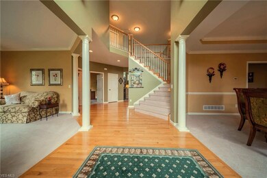 Gleaming hardwood floors are found throughout the 