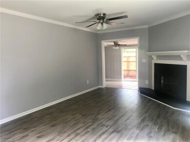 View from family room to porch and patio. New ceiling fans in both rooms.