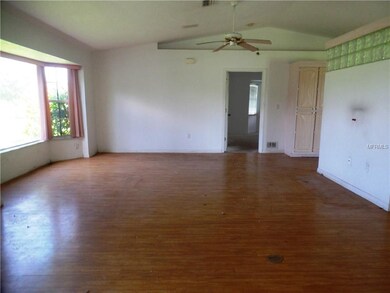 Living room with front bay windows.
