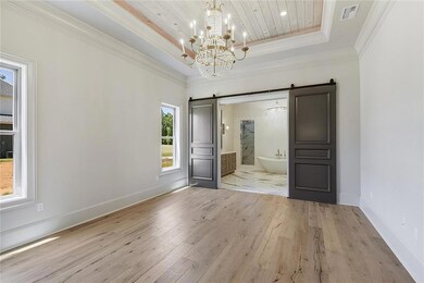 Large master with wood floors,private bath, and lu